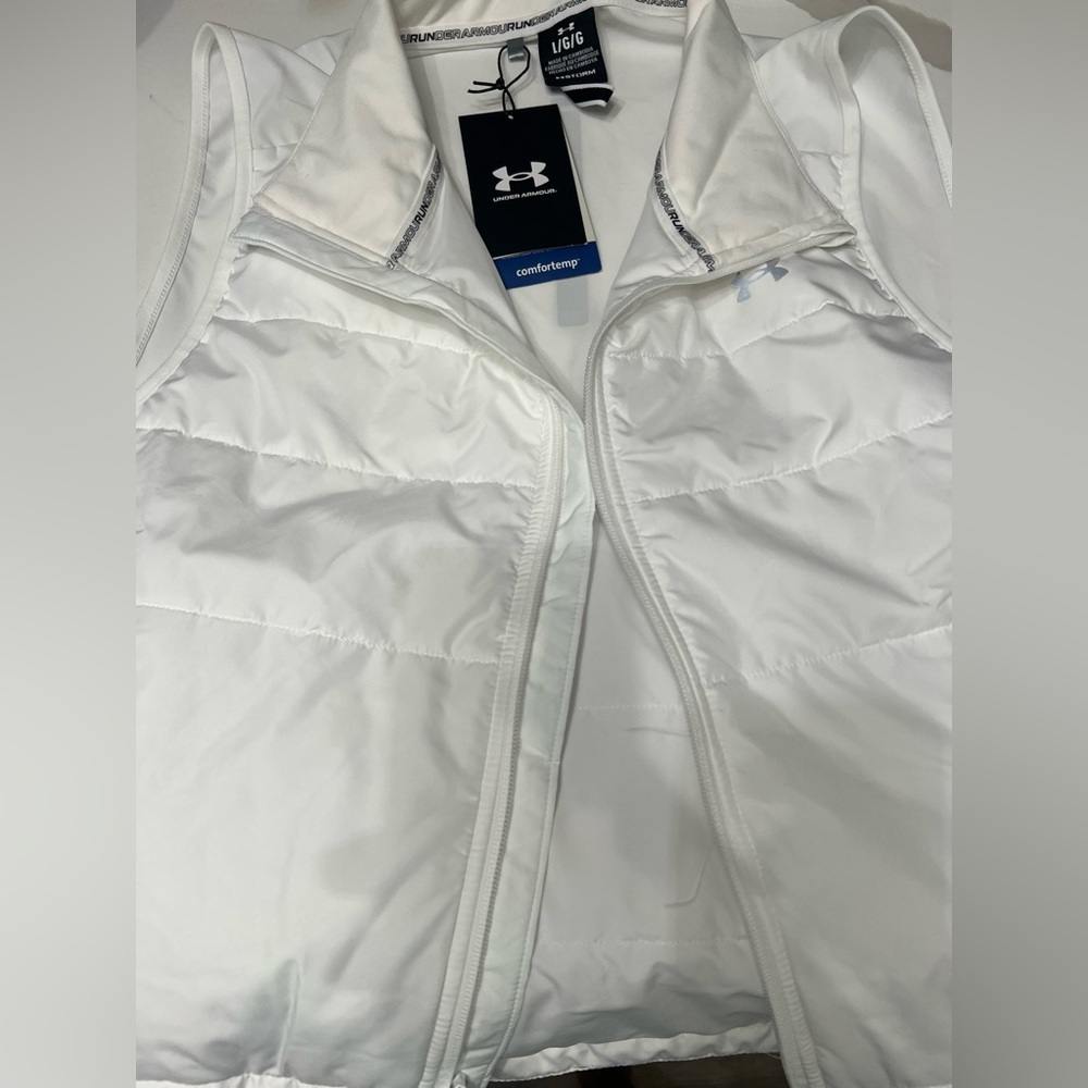 White under armor vest w/tags Also comes with white unstoppable pants w/o tags